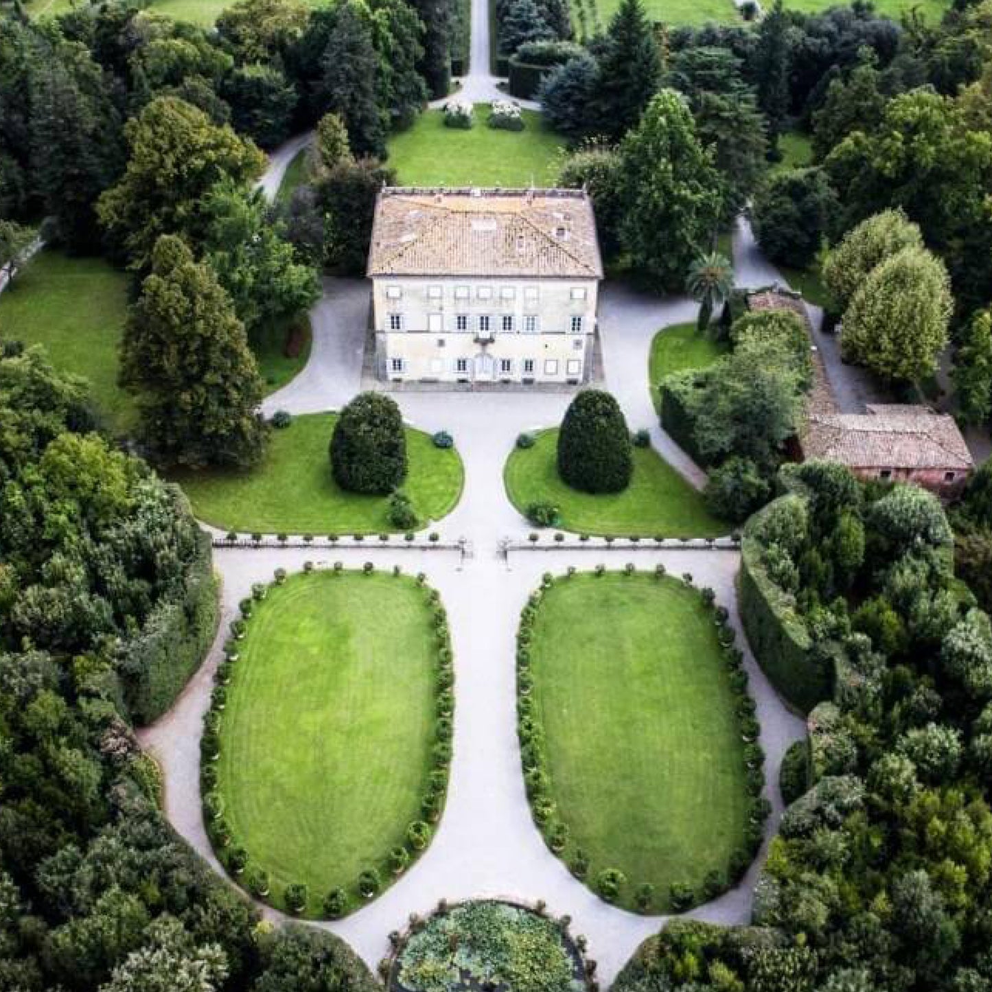 Overhead view of historic villa in Lucca, Italy, surrounded by beautiful gardens, where Nobile luxury scented candles are crafted, inspired by the villa's grounds.