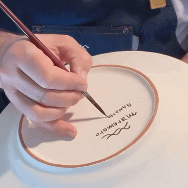 Back of Sicily ceramic plate, hand-signed by artisan with paintbrush, authentic handmade craftsmanship, made in Italy